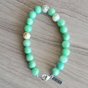 Green topaz colored bracelet with charm
